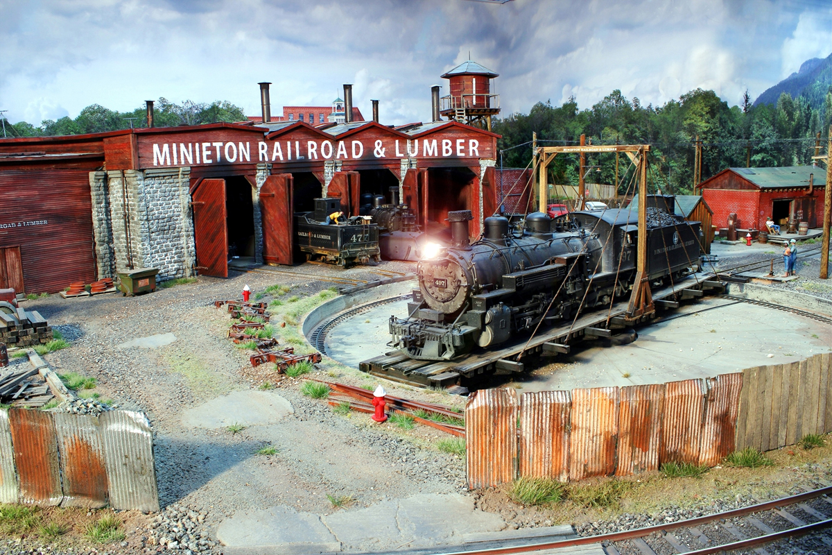 Minieton Railroad & Lumber Company locomotive 497 and roundhouse.